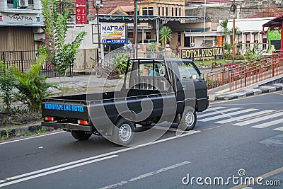 Mitsubishi L300 pick-up truck on the road driving fast blurry in motion Editorial Stock Photo