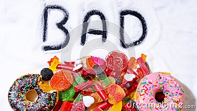 Mix of candy donut sugar word bad written Stock Photo