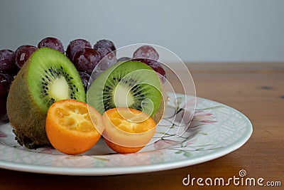 Mix of fruits, grapes, kiwi and orange Stock Photo