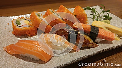 Mix maki sushi dish with fresh fish shashimi, Japanese food Stock Photo