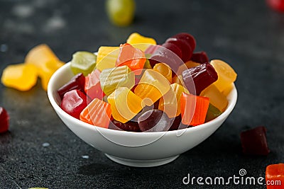 A mix of Midget Gems candy in white bowl. sweet food Stock Photo