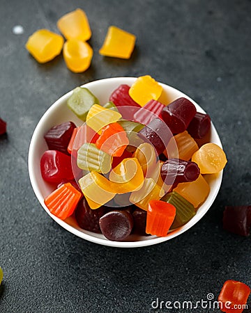 A mix of Midget Gems candy in white bowl. sweet food Stock Photo
