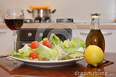 Mix salade tomato oil lemon wine Stock Photo