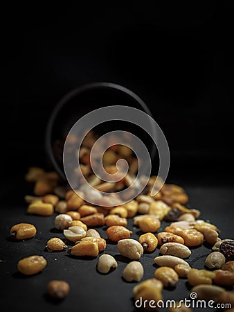 Mix of tasty nuts on dark table Stock Photo