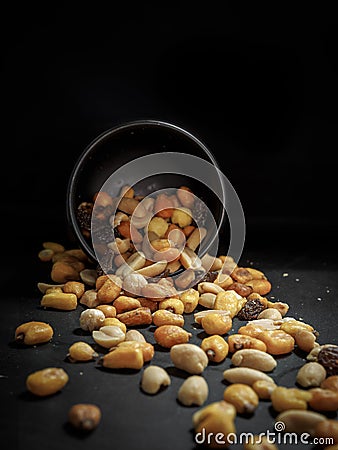 Mix of tasty nuts on dark table Stock Photo