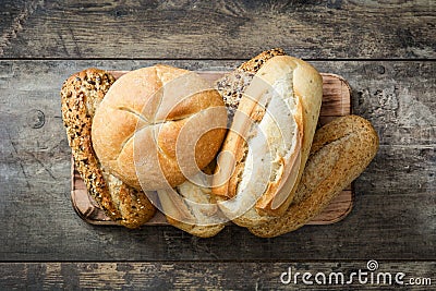 Mixed bread on wooden table. Stock Photo