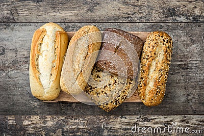 Mixed bread on wooden table. Stock Photo