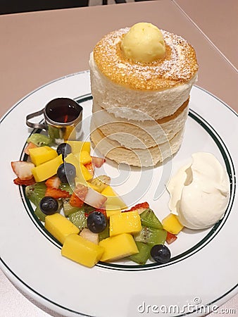 Mixed Cut fruit served in a thick pancake dish Stock Photo