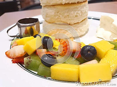 Mixed Cut fruit served in a thick pancake dish Stock Photo