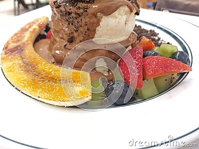 Mixed Cut fruit served in a thick pancake dish Stock Photo