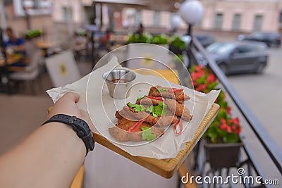 Mixed deep fried appetizer with dip sauce. Fried chicken, beer snack with dip sauce served on a wooden board Stock Photo