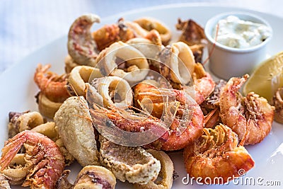 Mixed deep-fried fish, shrimp and squid platter Stock Photo