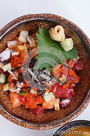 Mixed Donburi : Diced Salmon, Diced Tentacle Squid, Diced Maguro, Diced Unagi, Diced Cucumber with Ebiko and Seaweed. Stock Photo