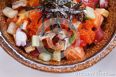 Mixed Donburi : Diced Salmon, Diced Tentacle Squid, Diced Maguro, Diced Unagi, Diced Cucumber with Ebiko and Seaweed. Stock Photo