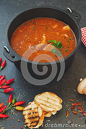 Mixed fish and tomato chowder Stock Photo