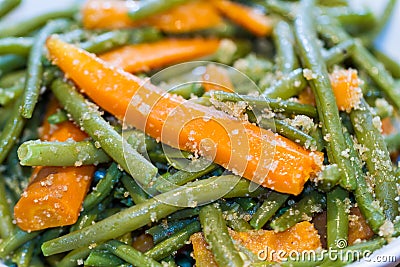 Mixed fresh green runner beans and carrots Stock Photo