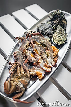 Mixed fresh seafood selection gourmet set platter meal on table Stock Photo