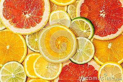 Mixed Fresh slices citrus fruit as background. Top view Stock Photo