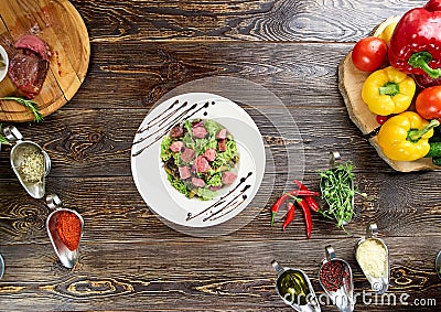 Mixed green salad with beef pieces. Stock Photo