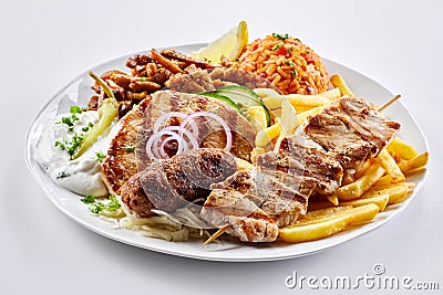 Mixed grill Greek plate with souvlaki and skewers Stock Photo