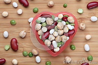 Mixed legume beans in a heart bowl Stock Photo
