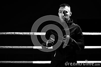 Mixed martial artist stands with his hands up. Concept of mma, ufc, thai boxing, classic boxing Stock Photo