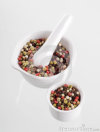 Mixed peppercorns in a porcelain mortar Stock Photo