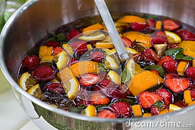 Mixed punch with fruits in metal bowl Stock Photo
