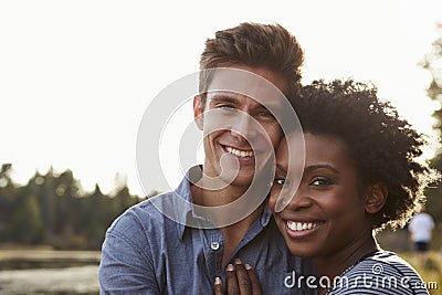 Mixed race couple in the countryside, looking to camera Stock Photo