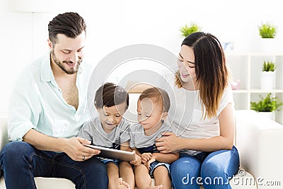 mixed race family watching the tablet Stock Photo