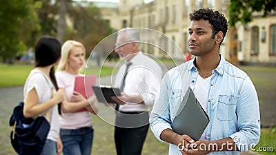 Mixed-race male student looking into distance, higher education and future Stock Photo