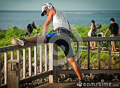 Mixed race man stretching Editorial Stock Photo