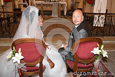 wedding man and woman interracial couple in ceremony church Stock Photo