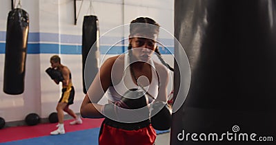Download Mixed Race Woman Boxing In Punchbag Stock Video - Video of ...