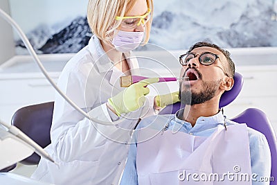 Undergoing Professional Teeth Cleaning Stock Photo