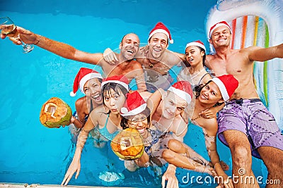 Mixed raced group of nine people celebrating christmas Stock Photo