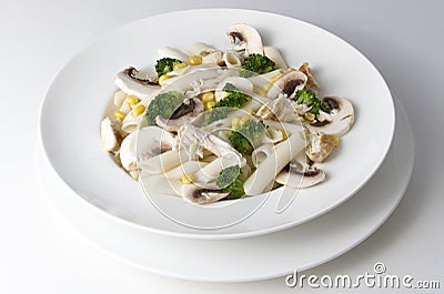 Mixed salad with eggs, pasta, mushrooms and chicken meat Stock Photo