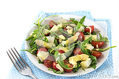 Mixed salad of white asparagus, cocktail tomatoes and rucola, ap Stock Photo