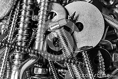 Mixed screws and nails. Industrial background. Home improvement.bolts and nuts.Close-up of various screws. Use for background, top Stock Photo