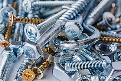 Mixed screws and nails. Industrial background. Home improvement.bolts and nuts.Close-up of various screws. Use for background, top Stock Photo