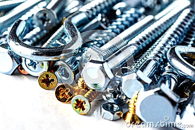 Mixed screws and nails. Industrial background. Home improvement.bolts and nuts.Close-up of various screws. Use for background, top Stock Photo