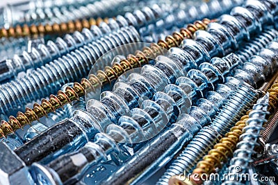 Mixed screws and nails. Industrial background. Home improvement.bolts and nuts.Close-up of various screws. Use for background, top Stock Photo