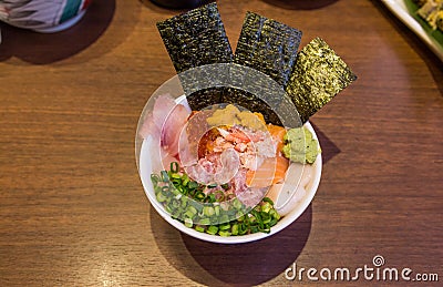 Mixed seafood donburi rice bowl with minced tuna, urchin and scallop Stock Photo