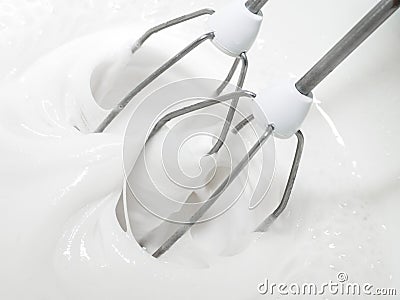 Mixer whisks whip pastry cream. Stock Photo