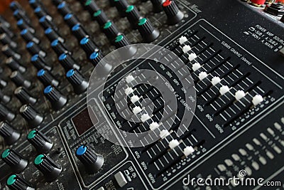 Mixing board with white and blue knobs close up Stock Photo