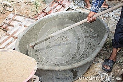 Mixing a cement in salver Stock Photo