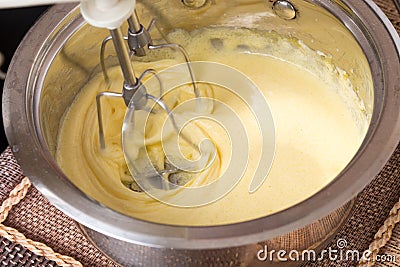 Mixing eggs and sugar for cake. Stock Photo