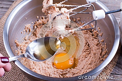 Mixing Muffin Cake Mixture For Baking. Add eggs and alcohol. Stock Photo