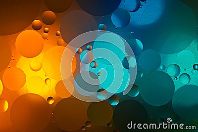 Mixing water and oil. Beautiful color abstract background based on blue, turquoise and yellow circles Stock Photo