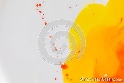 Mixing yellow and orange watercolors. Palette with autumn colors. Watercolor paints and splashes Stock Photo